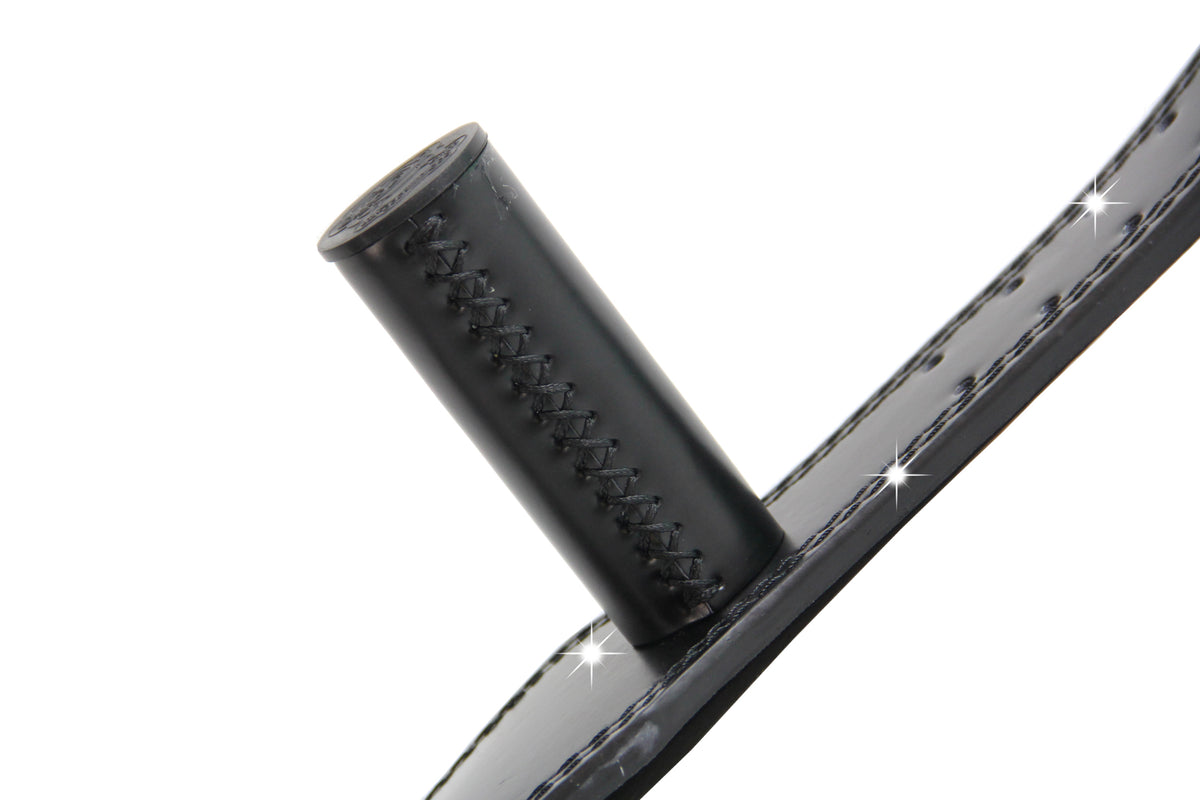 Close-up of a black MunkeyBarz grip bar stitched into the leather belt