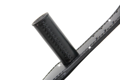 Close-up of a black MunkeyBarz grip bar stitched into the leather belt